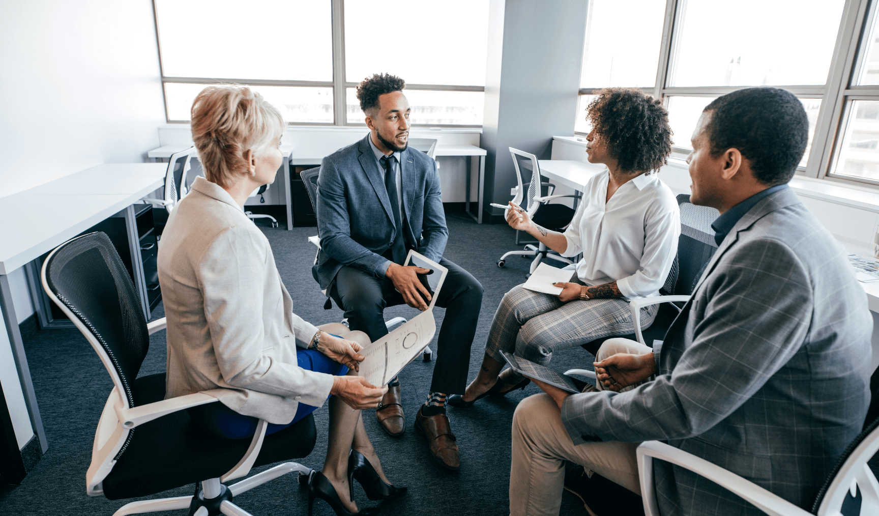 a group of colleagues having a meeting discussion