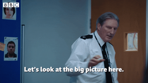 A police officer turns and says 'let's look at the big picture here'