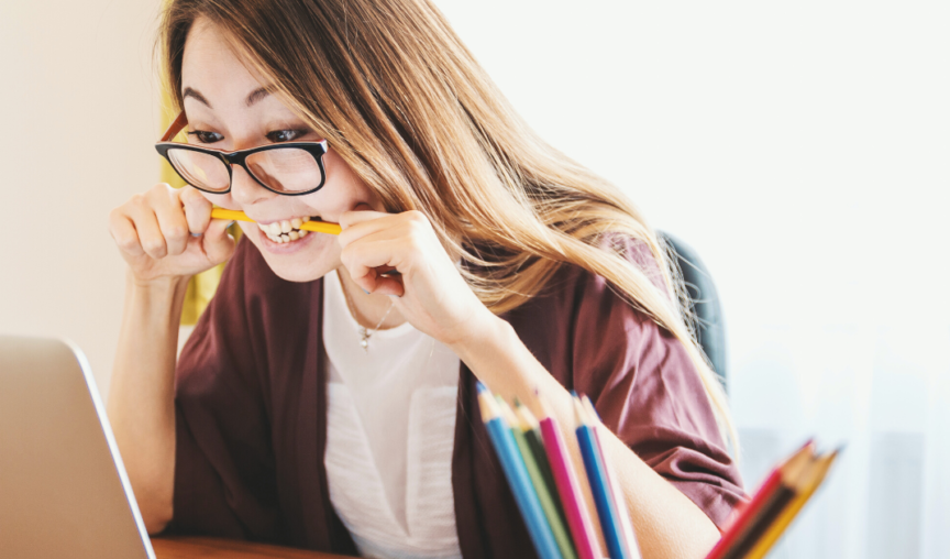 woman chewing a pencil - future of feedback