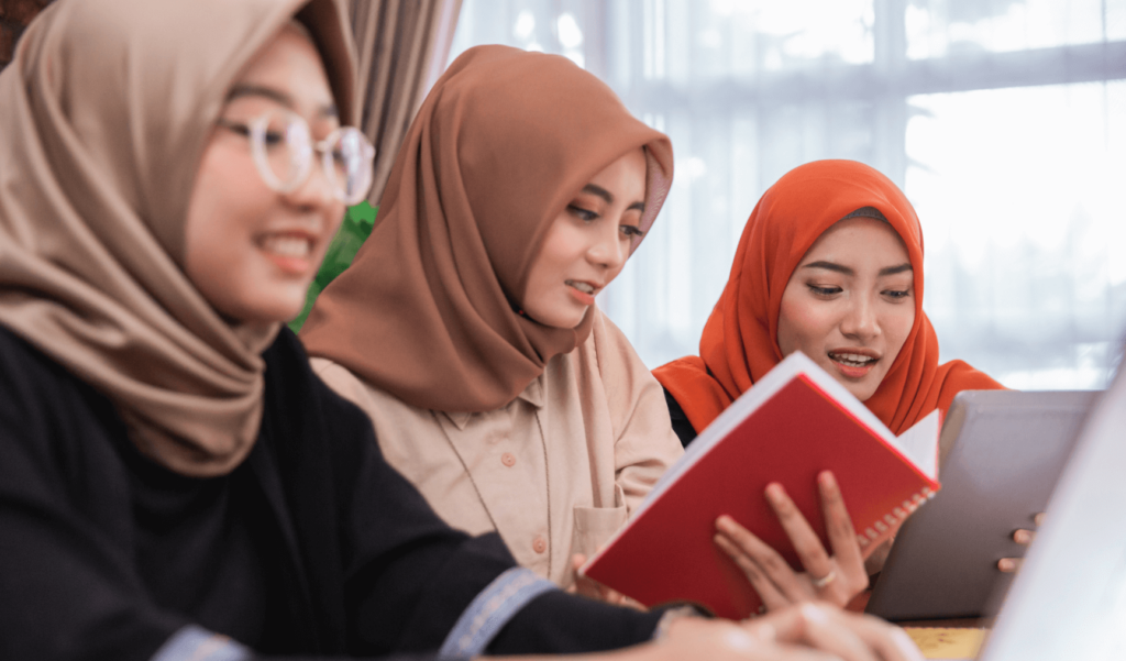 a group of women reading a book
