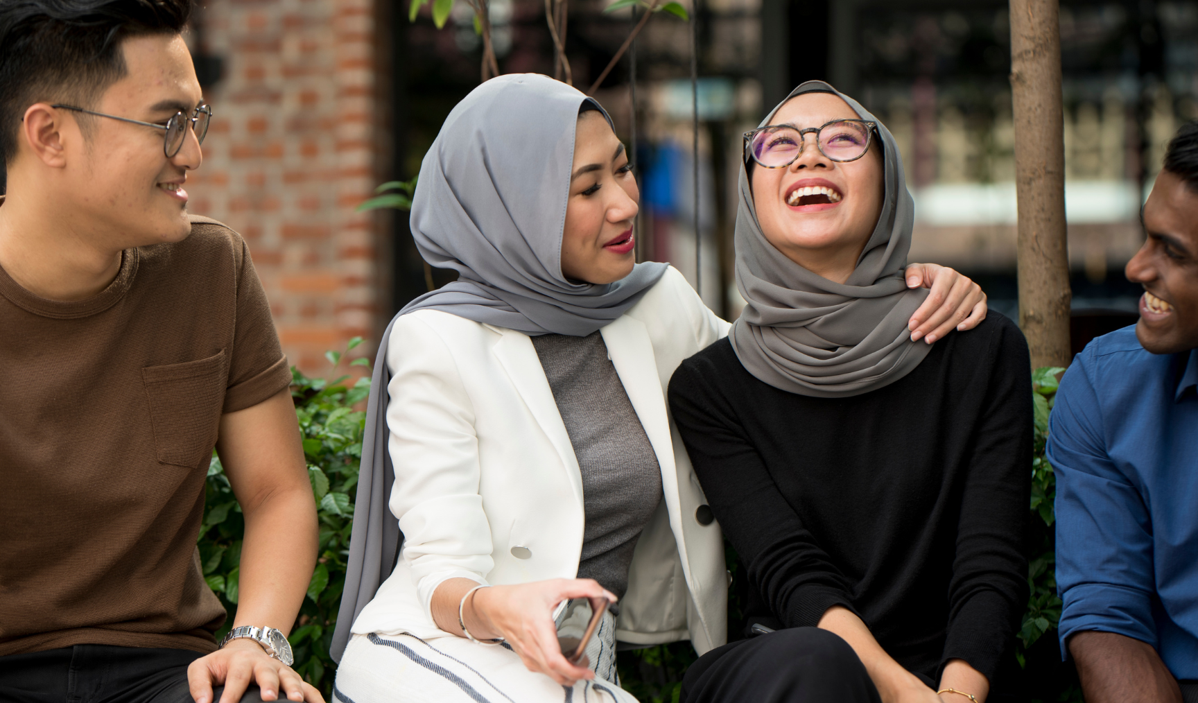 employees having a great time chatting outside the office