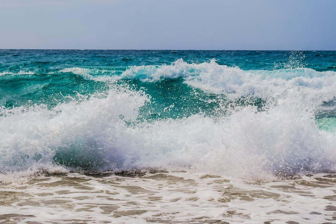 waves crashing onto the shore