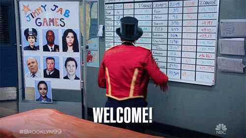 A man in a top hat turns around shouting 'welcome'