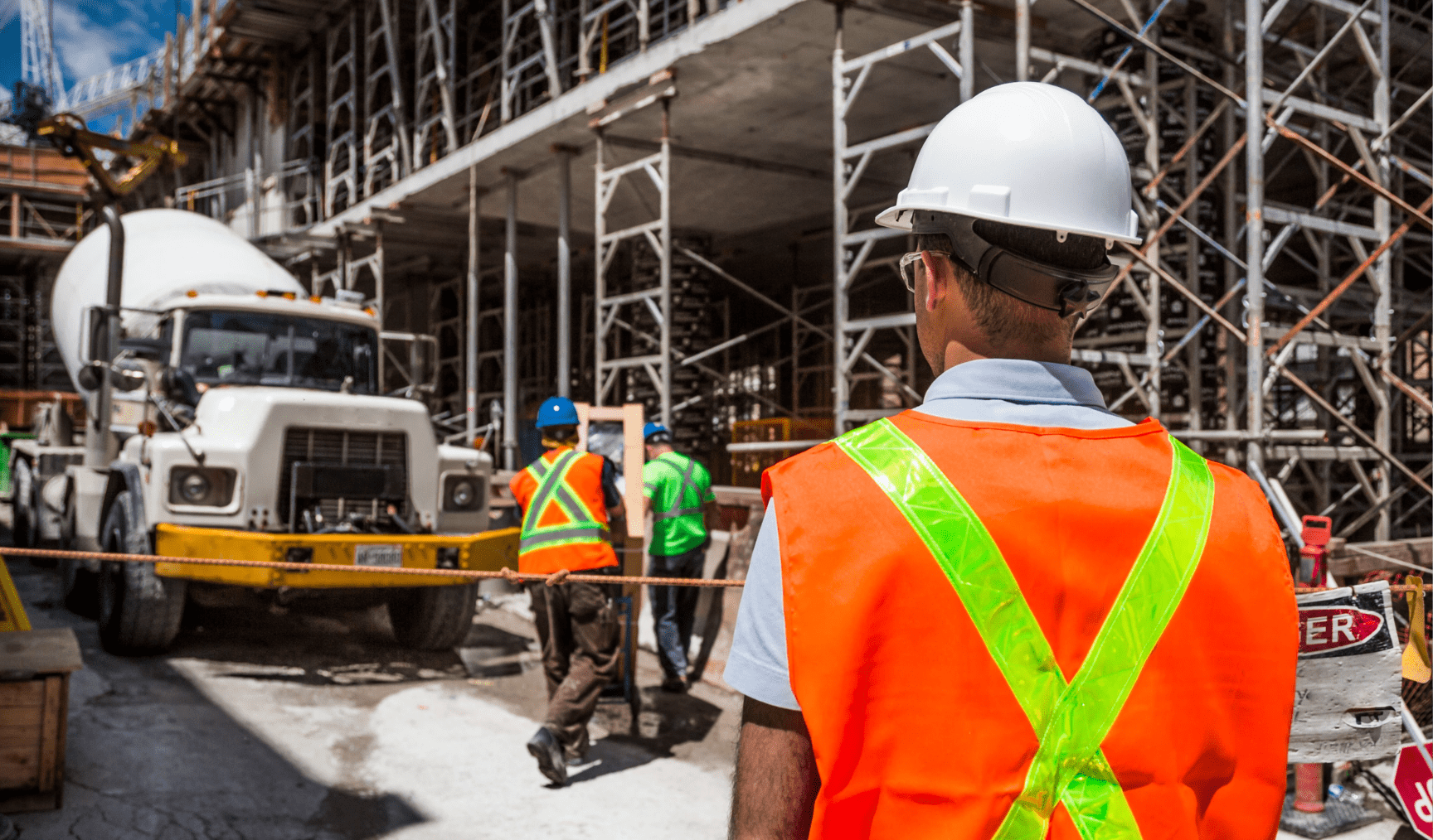 Man stands facing away on a construction site