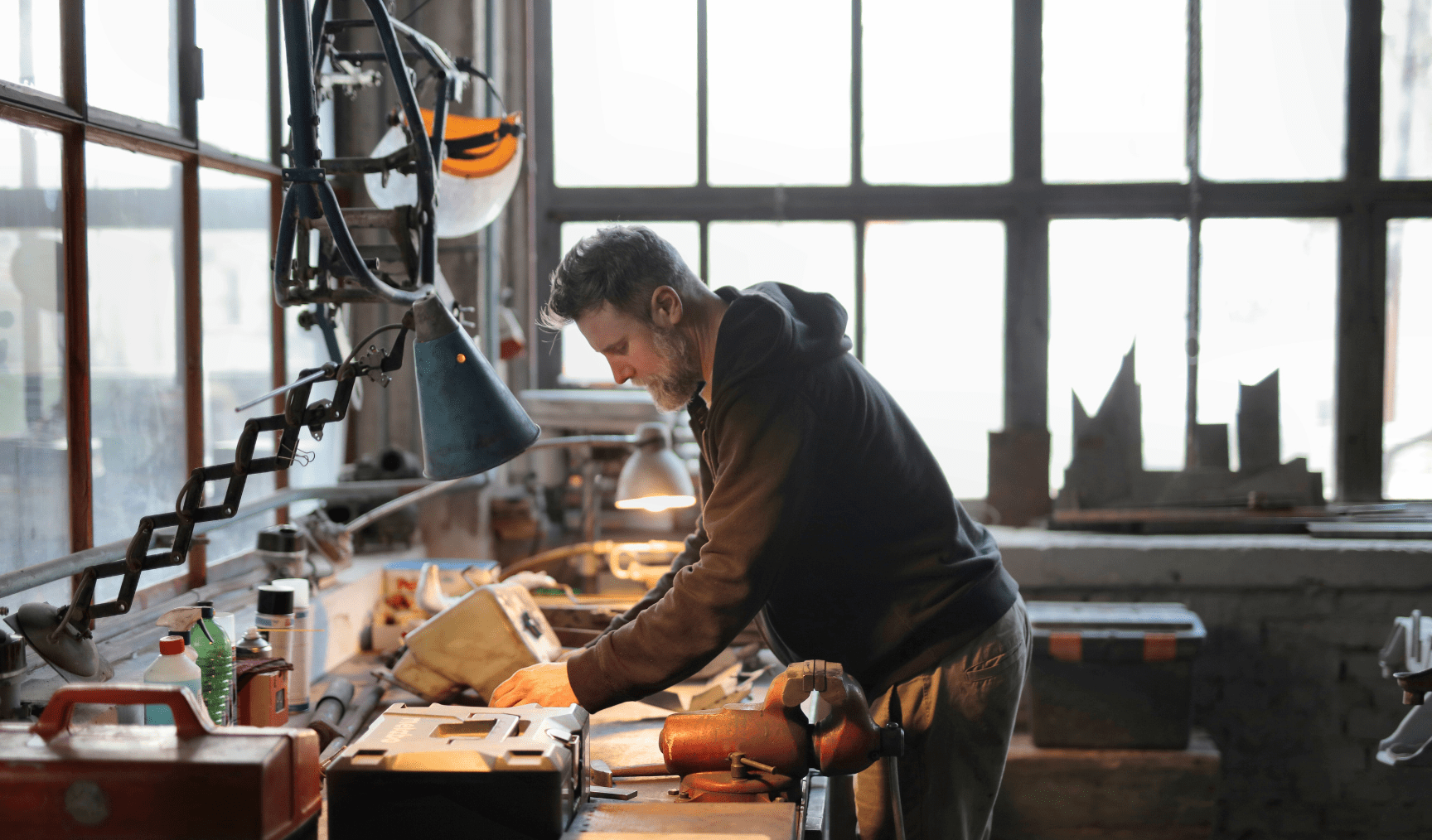 A man works at a welding station