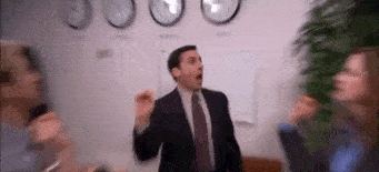 Michael Scott from the office highfives his colleagues