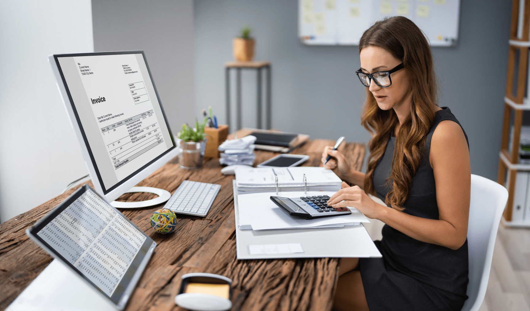 woman calculating numbers at the desk