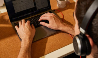 New Zealand payroll basics - man typing on computer