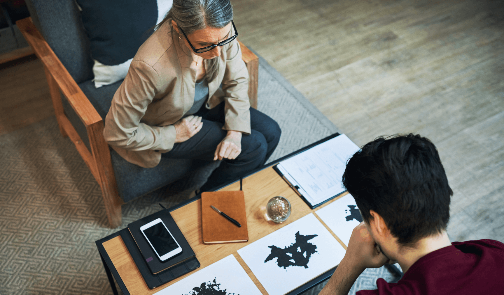 a therapist conducting a Rorscharch test with their client