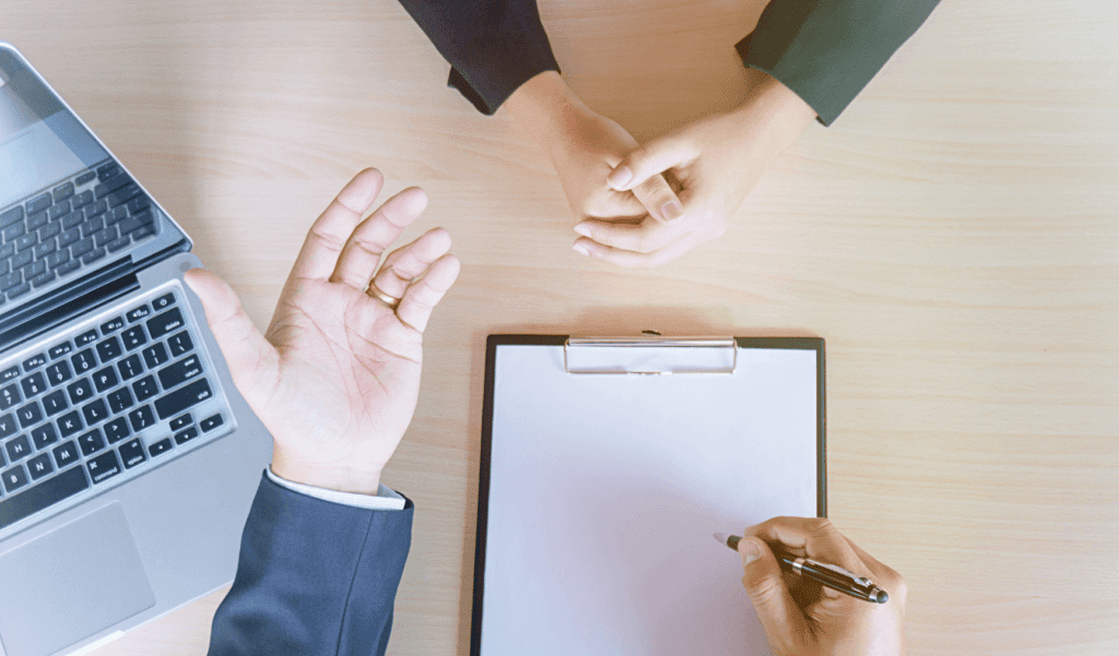 an overhead view of two people conducting an interview
