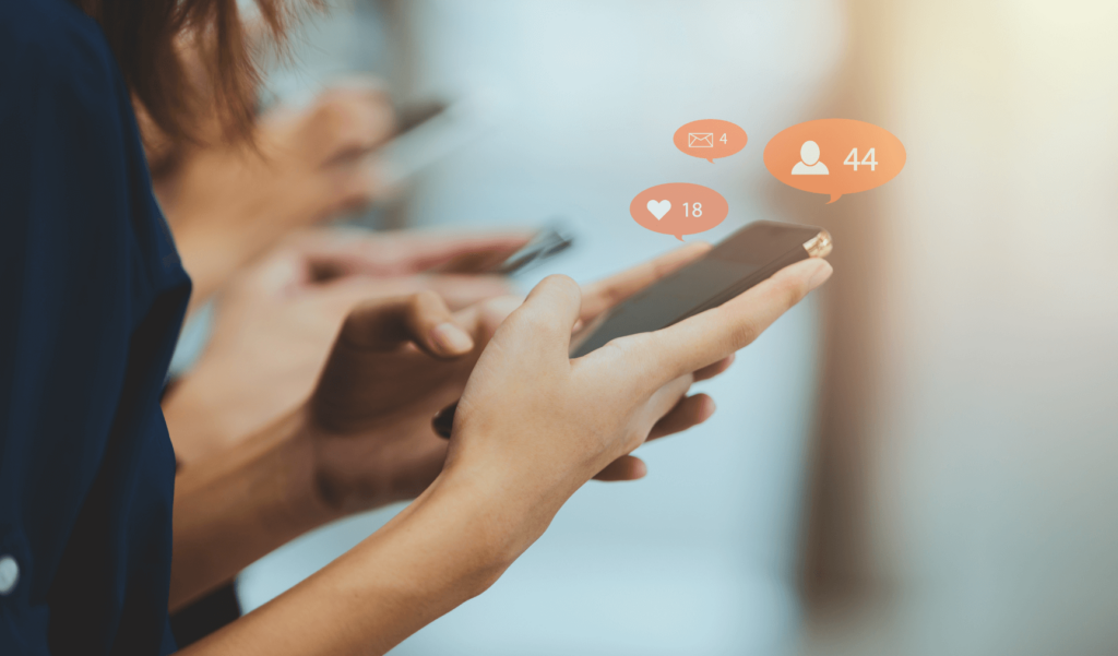 woman using a phone with notification bubbles