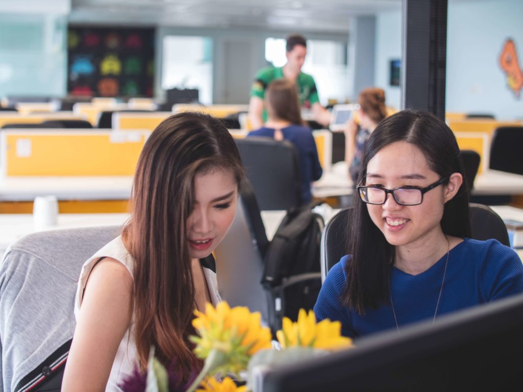 Two women chatting in the office