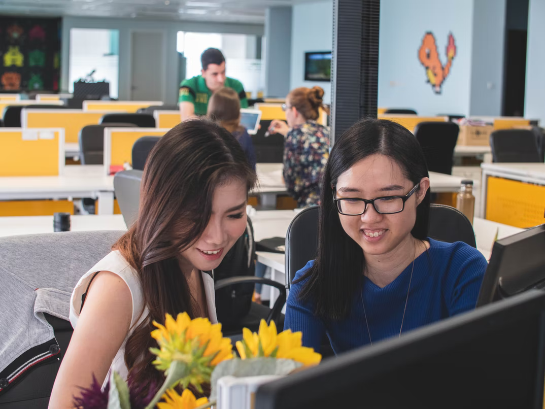 two colleagues chatting in the office