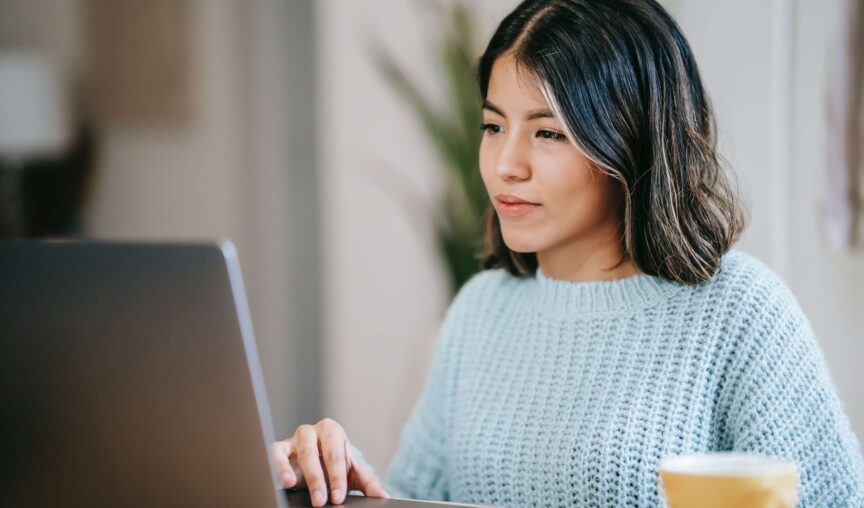 woman working remotely on her laptop