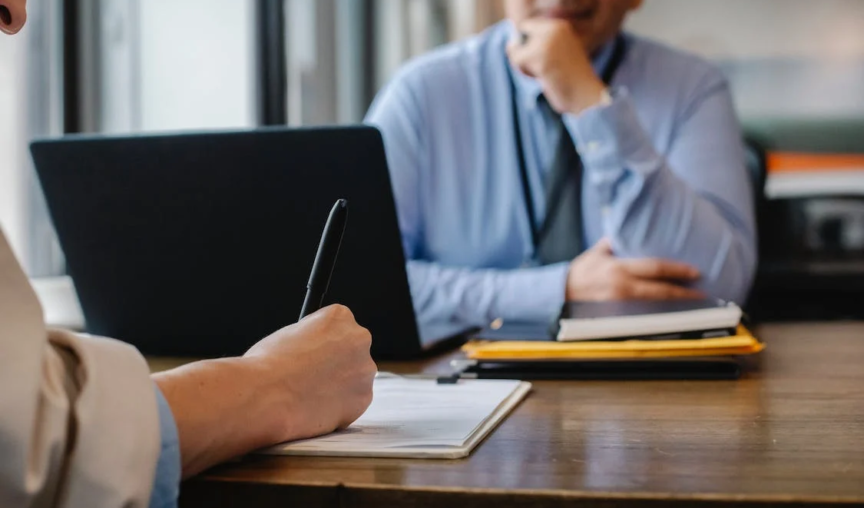 two people having a discussion in the office