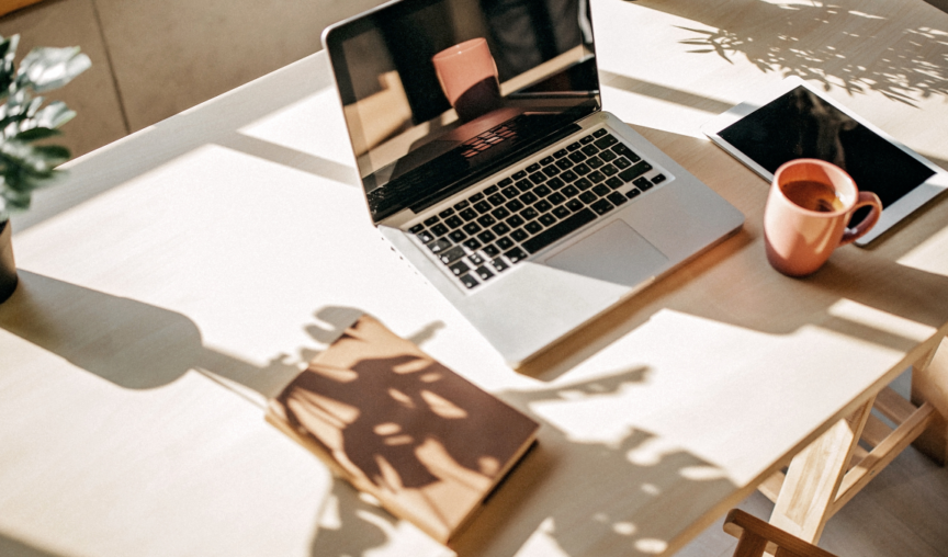 image of a desk with laptop -product update may