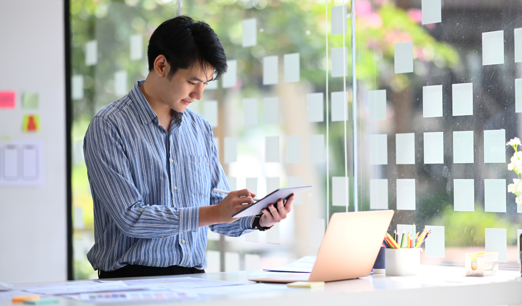 guy using a tablet while at work