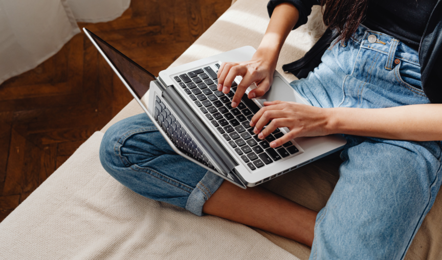 woman typing on laptop