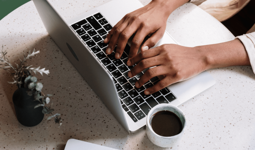 image of a person typing on a laptop