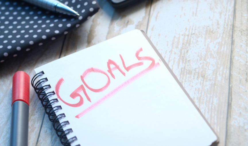 Notebook with the word 'goals' written in big letters on the front page