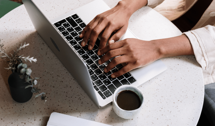 image of a person typing on a laptop