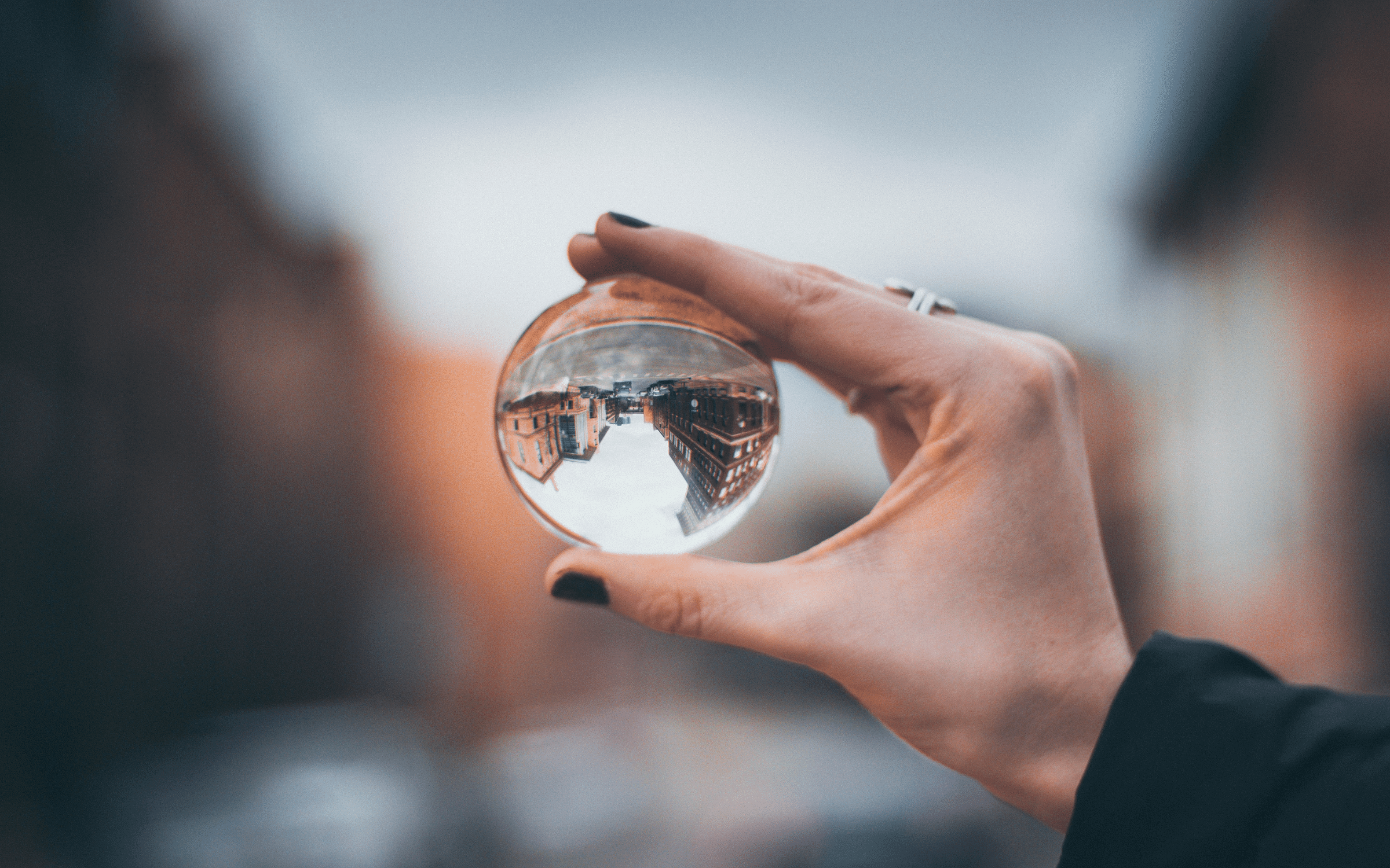 Hand holding crystal ball