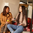 two people speaking in van