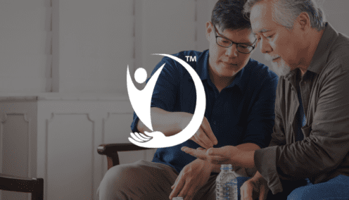 Tradern - image of a young man helping an older man
